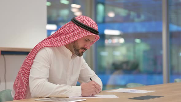 Arab Businessman Having Failure Writing on Paper