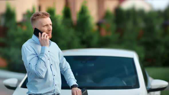 Successful Bearded Confident Male Talking Using Smartphone Outdoor Medium Shot