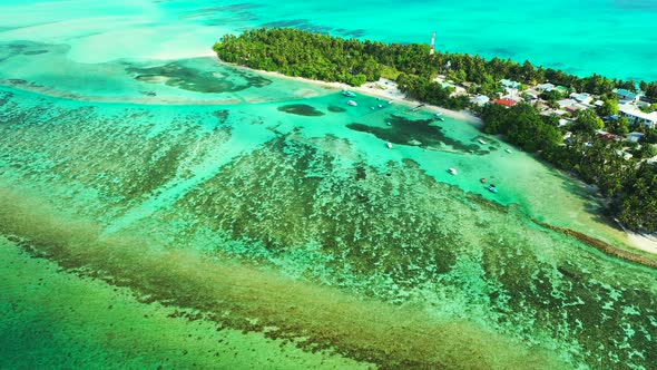 Beautiful drone travel shot of a sandy white paradise beach and blue water background in best qualit