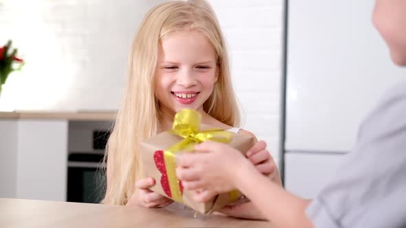 Little Boy Gives His Beloved Girl Valentines Day Gift Box