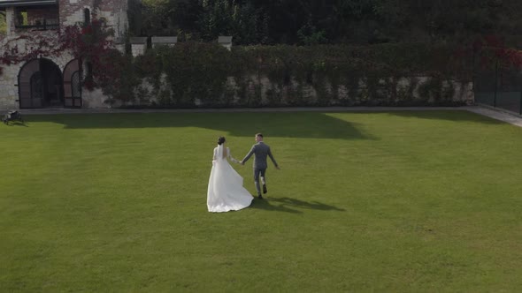 Lovely Newlyweds Caucasian Bride Embracing Groom in Park Making Kiss Wedding Couple Family Hugging