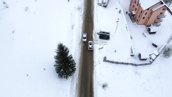 Car Moving Forward By Winter Road Aerial View