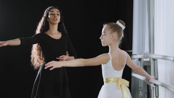 Adult Woman Dancer Dance Teacher Coach Tells Teenage Girl Ballerina Advice Helps Move Gracefully