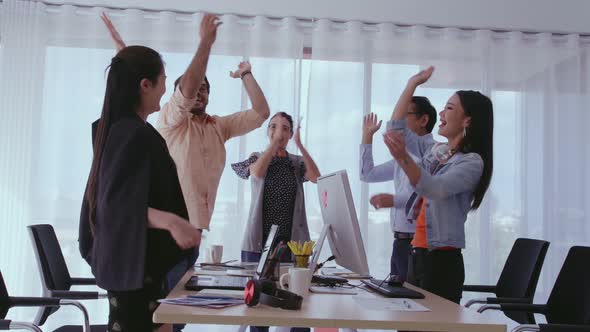 Successful Business People Celebrating Project Success at Office