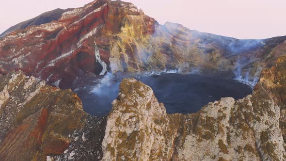 Aerial View of Volcano Crater Spewing White Gas and Ashes