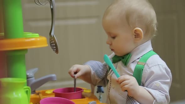 Happy Mother with Her Son Having Fun in the Kitchen