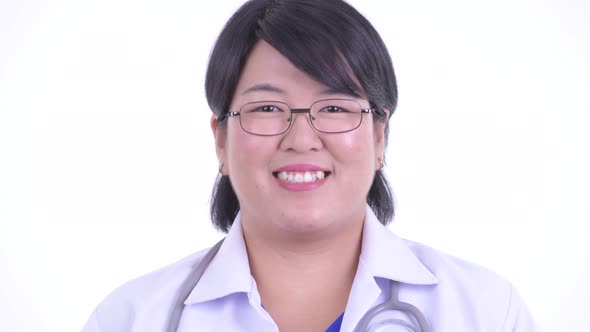 Face of Happy Overweight Asian Woman Doctor Smiling