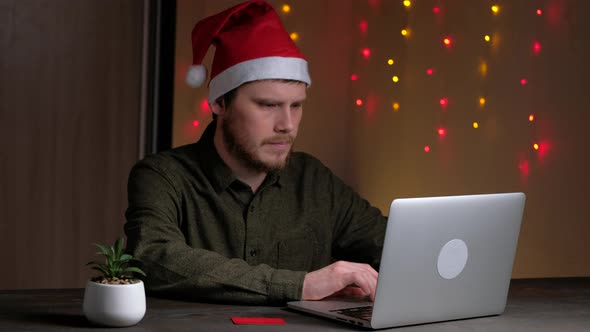 Person Man Using Laptop in Home at Night