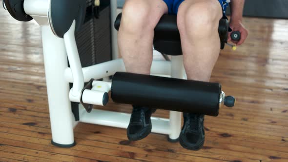 Close Up Senior Man Training Legs at Gym.