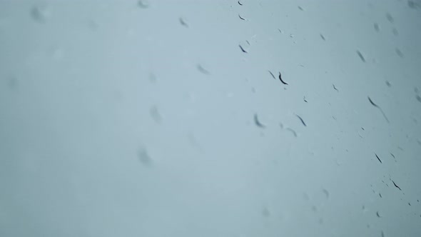 drops of water on the window. camera movement along wet glass on a rainy day