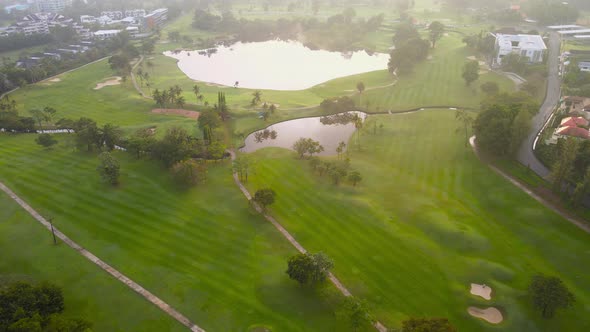 4K Aerial view Top-down view of Lawn Golf course in the morning or evening light, beautiful green