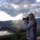 Photographer Woman By Lugano Skyline - VideoHive Item for Sale