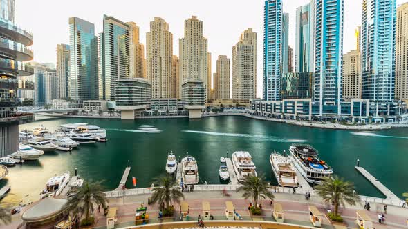 Dubai Marina with Modern Buildings and Traditional Boat Timelapse