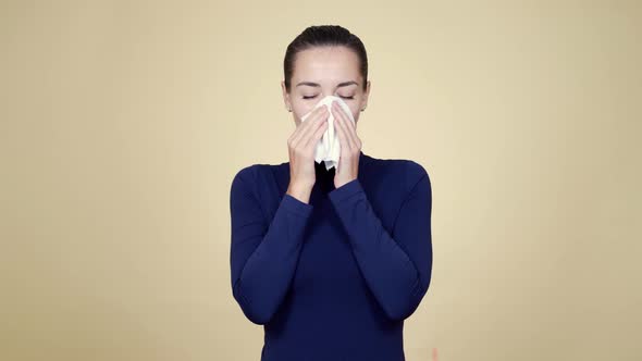 Girl Feeling Bad, Blows Her Nose in Napkin and Coughs, Isolated on Background