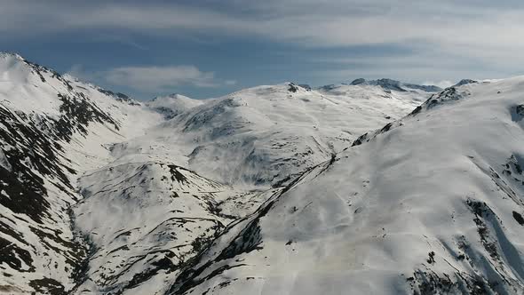 Aerial video of the Swiss Alps from Andermatt, Switzerland during winter (3)