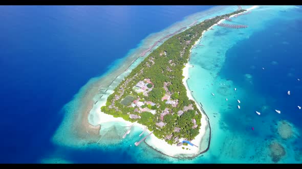 Aerial drone shot scenery of beautiful seashore beach lifestyle by blue water and white sand backgro