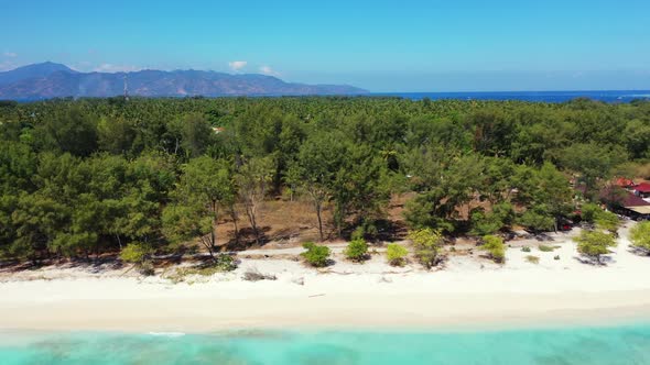 Aerial drone view nature of tranquil shore beach holiday by blue sea with white sandy background of 