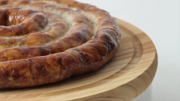 Hot Homemade Sausage Lies on the Cutting Board