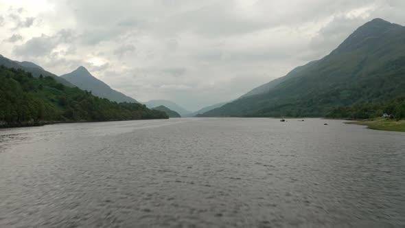 Low fast drone shot over Scottish Loch Leven