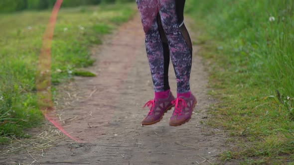 Closeup of Fitness Woman Skipping with Jump Rope