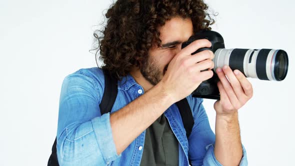 Photographer taking photo with professional digital camera