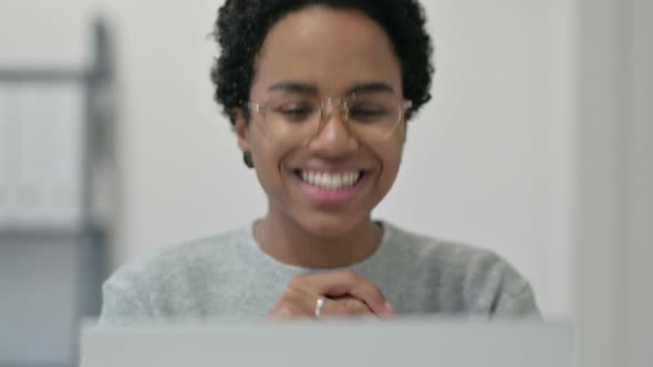 Portrait of African Woman Doing Video Chat on Laptop 