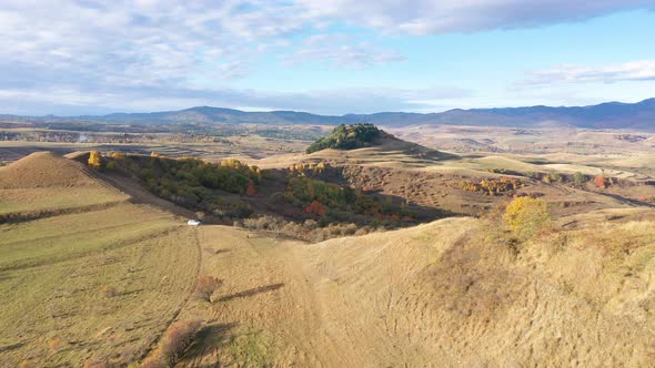 Aerial Drone View of Countryside Hills, Autumn Meadow by Drone. Transylvania, Romania