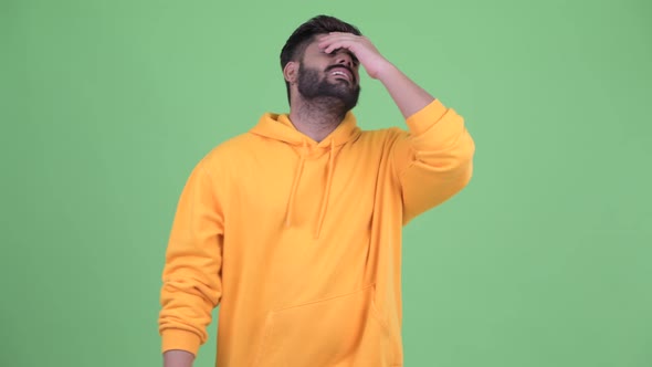 Stressed Young Overweight Bearded Indian Man Getting Bad News