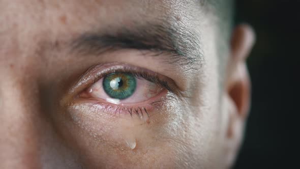 Closeup Shot of Crying Man with Tears in Eye