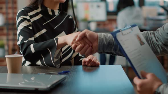 Executive Manager Greeting Male Candidate at Job Application Meeting