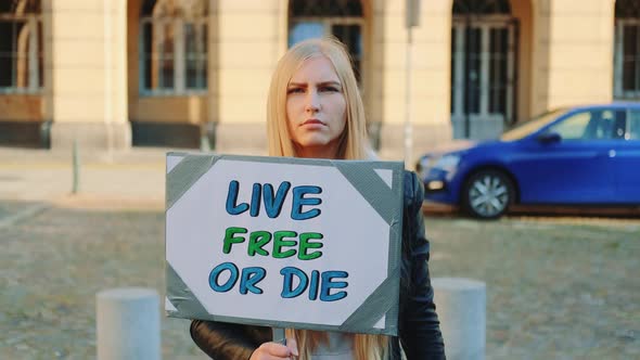 Woman with Protest Banner Calling To Live Free or Die