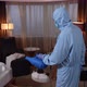 Disinfection Specialist Spraying Bed in Hotel Room - VideoHive Item for Sale