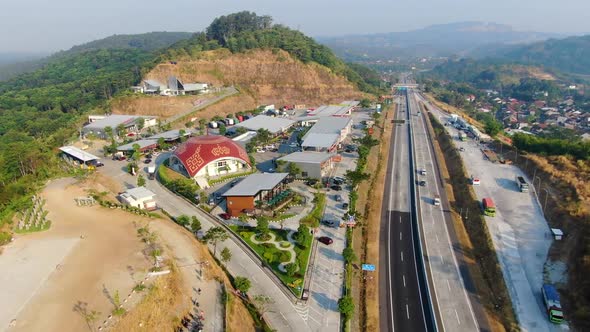 Highway near Salatiga, Indonesia with rest place for drivers with mosque, aerial