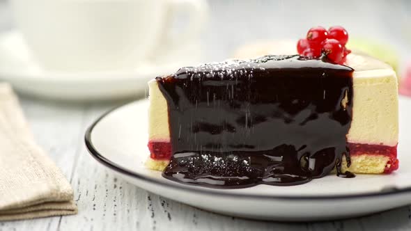 Chocolate Covered Redcurrant Cheesecake Is Being Powdered with Icing Sugar. Slider Shot, FHD