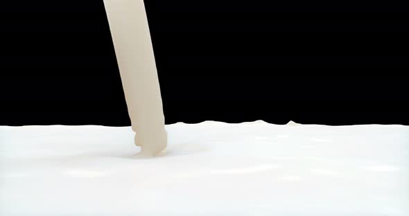 A Stream of Milk Pours Down