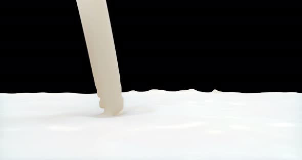 A Stream of Milk Pours Down alt