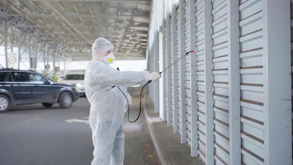 Worker Wearing Protective Suit Disinfection Gear Disinfect Surface Public Place