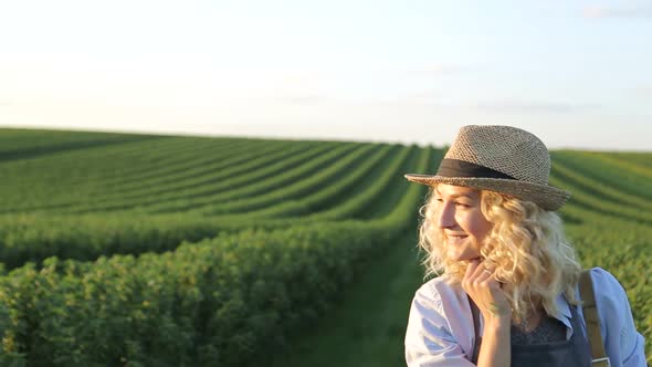 Woman artist painting with oil paints in a field