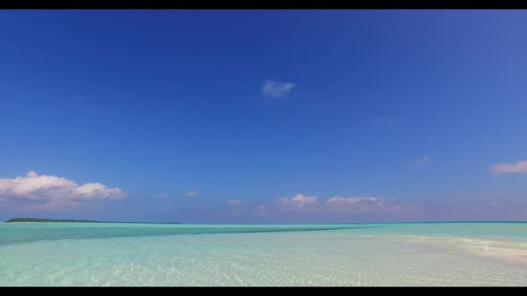 Aerial drone shot panorama of perfect shore beach voyage by blue lagoon with white sandy background 