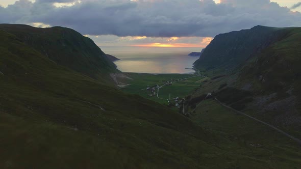 Drone Shot Over Hoddevika with the View of the Sunsetting on the Sea