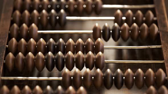 Vintage wooden abacus with beads and metal wire seamless looping animation.