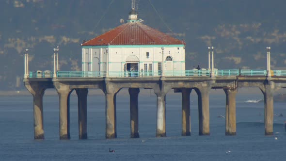 The Manhattan Beach Pier stands majestic over the Pacific Ocean.