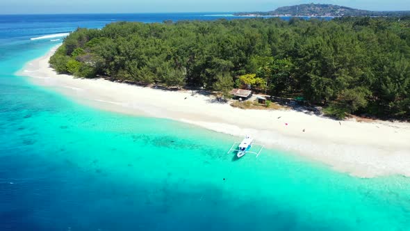 Aerial above texture of relaxing shore beach holiday by blue green lagoon with bright sand backgroun