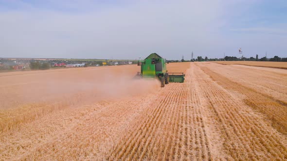  Impressive Flight Over a Working Combine Harvesting Tons of Ripe Barley