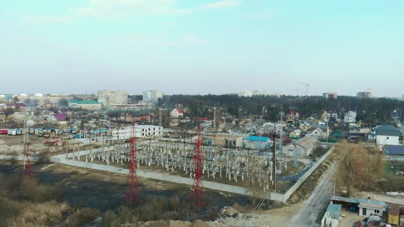 Hydroelectric power station. Electric substation with tall pylons and hog voltage distribution cable