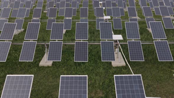 Aerial View of the Solar Panel Farm. The Drone Flying Over the Solar Panel Factory