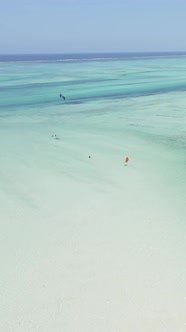 Vertical Video Kitesurfing Near the Shore of Zanzibar Tanzania