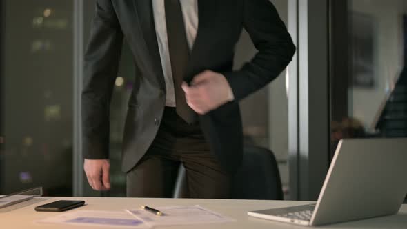 Young Businessman Came Back and Working on Desk at Night