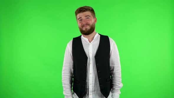 Man Smiles and Showing Heart with Fingers Then Blowing Kiss. Green Screen