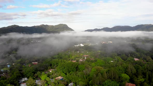Low clouds over Valle de Anton town in central Panama located inside extinct volcano crater, Aerial